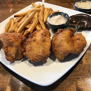 a plate of fried chicken and french fries