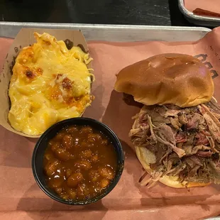 Pulled pork sandwich, baked beans side, side of mac and cheese