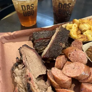 3 meat combo.  Beef brisket, pork ribs and smoked sausage with Mac and cheese, baked beans