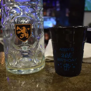 a glass of beer and a mug