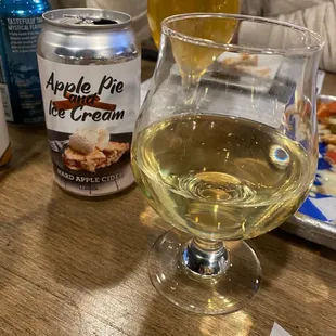 a glass of beer and a can of apple pie ice cream