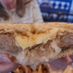 Cross section of sausage and sauerkraut grilled cheese