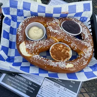 Giant pretzel with old bay queso, honey butter mustard, jalapeño raspberry jam.