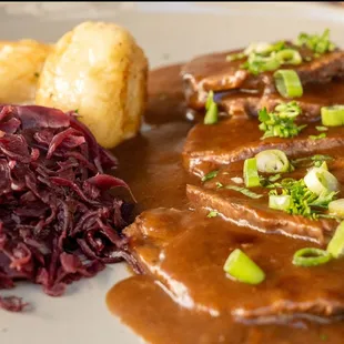 Sauerbraten with Klöße
A traditional German beef dish served with dumplings and red cabbage