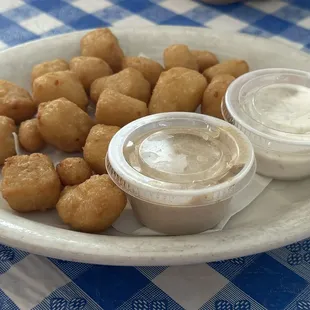 Cheese curds, honey mustard or dill dipping sauces, or just eaten plain. All yummo!