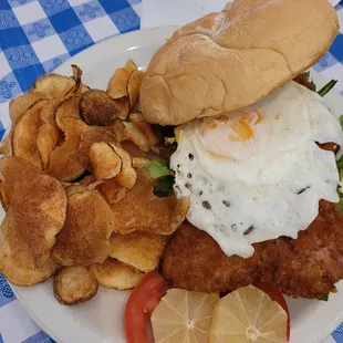 Weiner Schnitzel with egg and homemade potato chips.