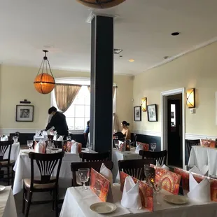 a dining room with tables and chairs
