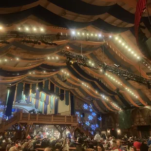 a large crowd of people sitting at tables