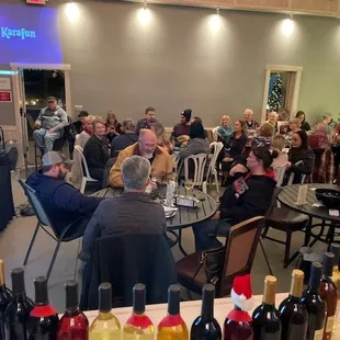 a large group of people sitting around a table