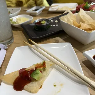 Tuna &amp; Salmon Tower on a chip with sauce