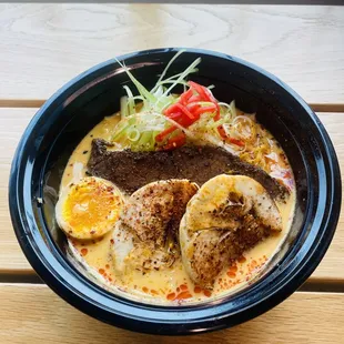 a close up of a bowl of ramen