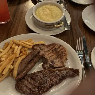 Trio plate. Sausage, steak and pork chop Mashed potatoes and French fries