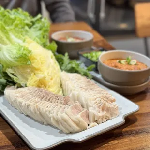 a plate of fish and lettuce