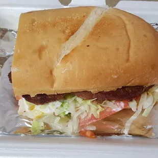 Hot sausage po-boy, dressed no cheese.