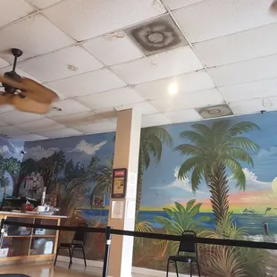 a mural of palm trees