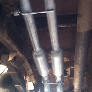 True Duals with 18" Glasspacks and turndowns.