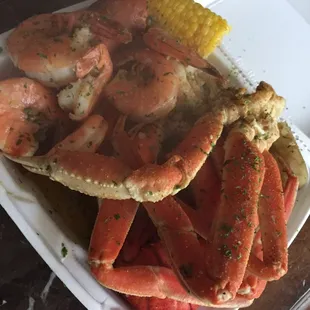 Crab, shrimp, potatoes, lobster, and corn.