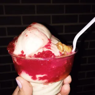 Banana whip with crushed cherries and wet nuts.