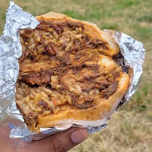 The  beef patty with coco bread and oxtail with peas and rice