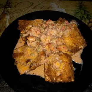 Fried five cheese Ravioli w/creamy crawfish cheese sauce