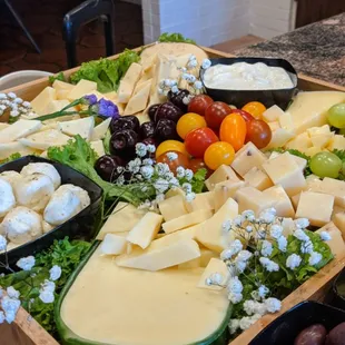 Assorted cheeses and olives with fresh baked sourdough bread sticks