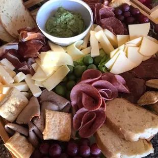 Charcuterie Board with Assorted cured meats and cheese and freshly baked sourdough