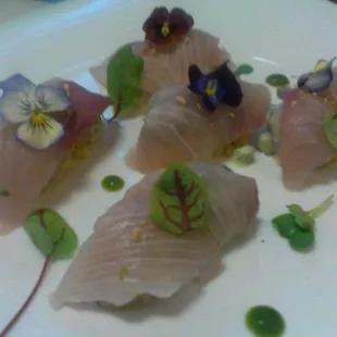 Cured Hamachi served over spicy sauteed fresh corn and a tarragon puree