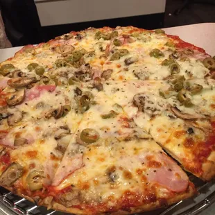 Medium Canadian bacon green olive mushrooms.