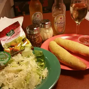 Caesar salad &amp; bread sticks with bonus human hair.
