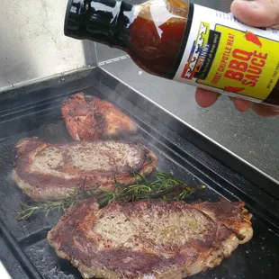 Steaks on the grill with F &amp; S Sweet Chipotle Heat BBQ Sauce