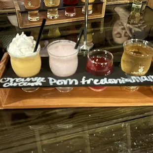 Build your own flight with orange cream ice cream wine slush, pomegranate slush, Fredonia wine, and mango cider!