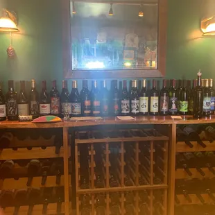 a wine rack with many bottles of wine