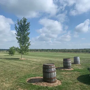 several barrels in a field