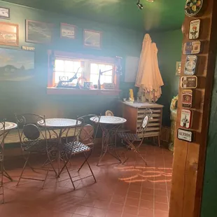 a dining room with tables and chairs
