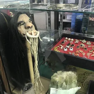 Shrunken head next to a green calcite rock lol so random