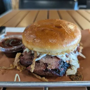 Signature brisket with slaw and onion straws