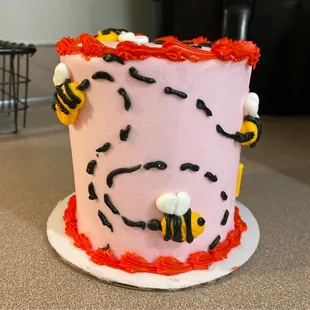 a cake decorated with bees