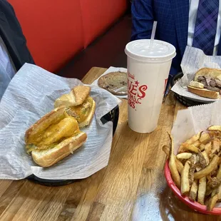 Tuna melt, roast beef, fries and a cookie.