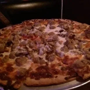 Italian sausage and mushroom cracker-crust pizza.