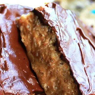 a plate of cookies and a chocolate frosted cookie