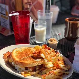Bacon, egg and cheese on rye with American fries