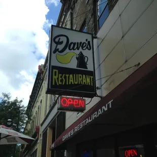 Dave&apos;s sign greets you from down the block, beckoning you to come in or eat outside on the sidewalk patio.