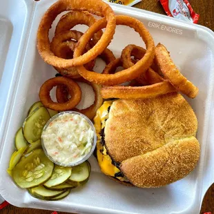 Carryout order of a Double Cheeseburger with grilled onions and an Onion Ring upgrade.