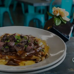 a plate of food and a glass of wine