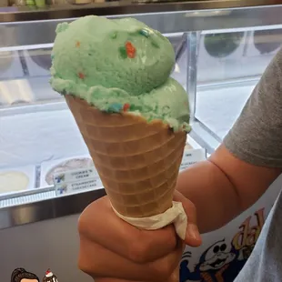 Double scoop blue cotton candy in waffle cone