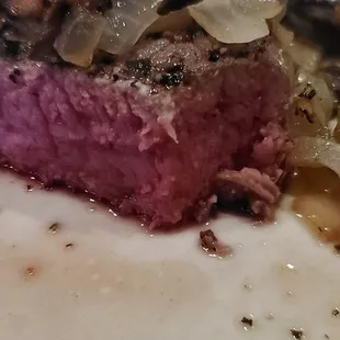 Close-up of a rare sirloin steak. Delicious! Mostly devoured at this point.