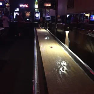 a shuffler table in a bar