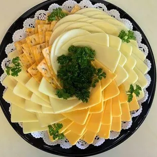a platter of cheese and crackers