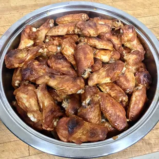 Cooked Hot Wings cut and Marinated in house