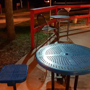 a blue table and blue stools